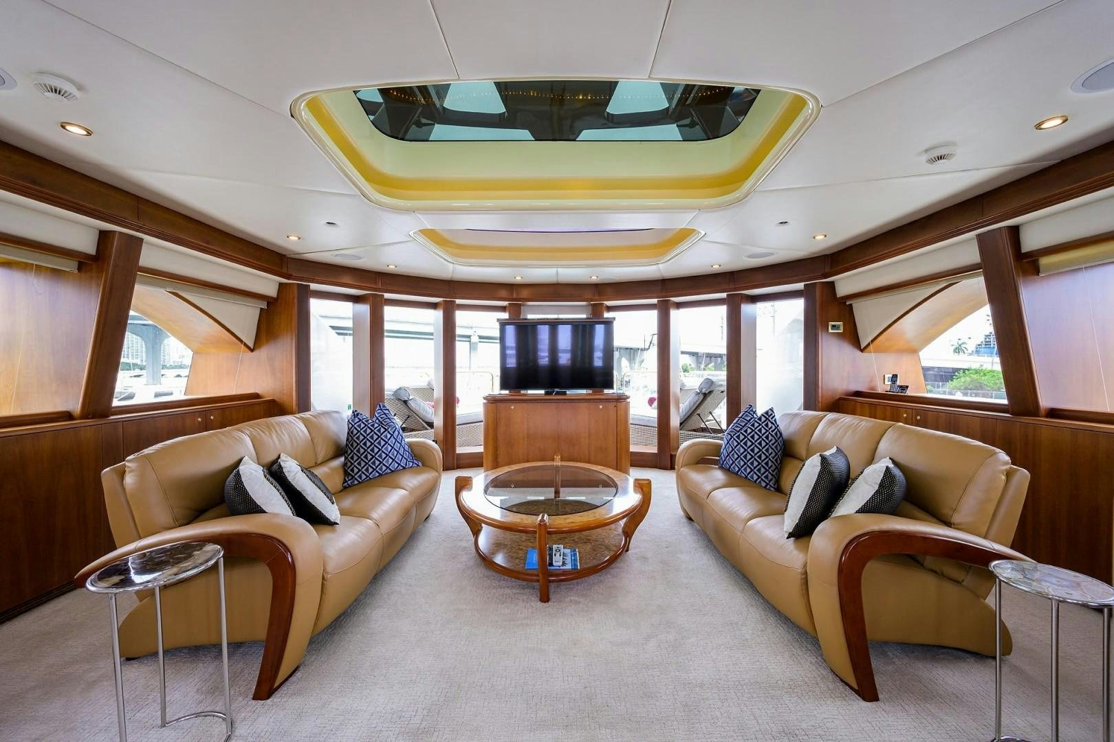 a living room with a large window aboard CABERNET Yacht for Sale