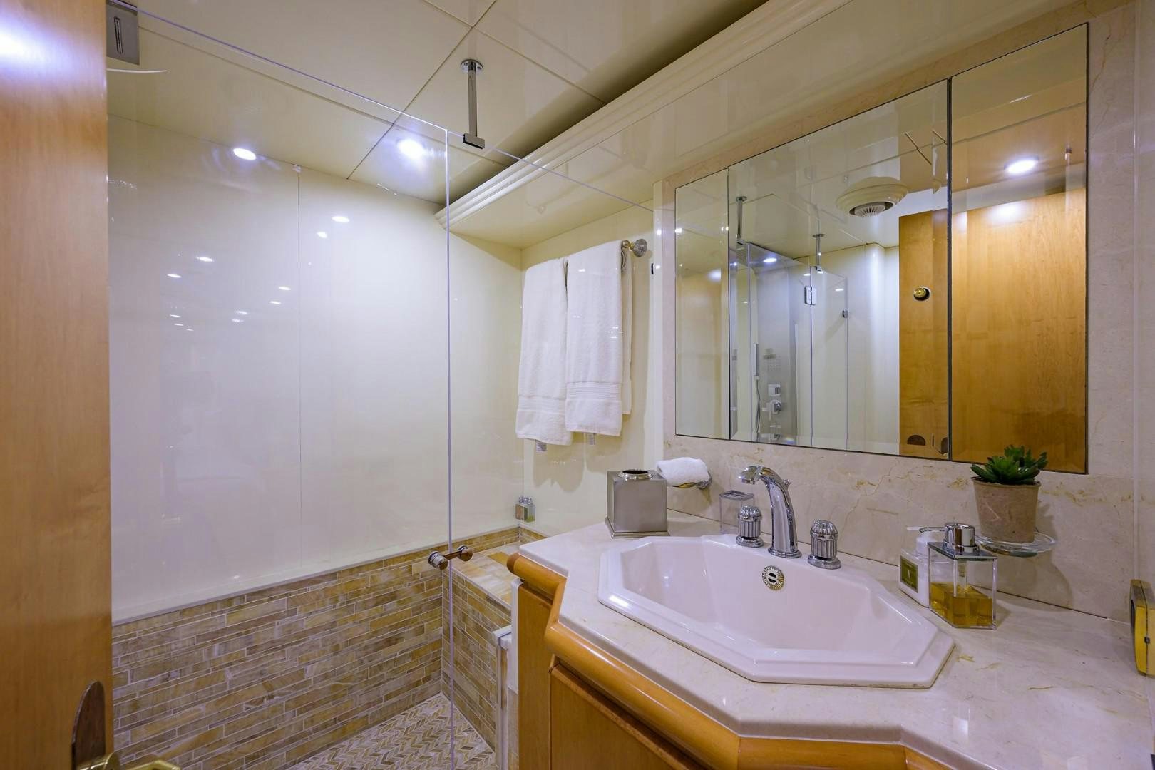 a bathroom with a large mirror aboard CABERNET Yacht for Sale