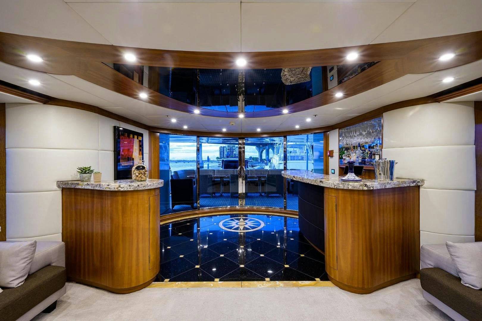 a room with a glass door and a large glass window aboard CABERNET Yacht for Sale