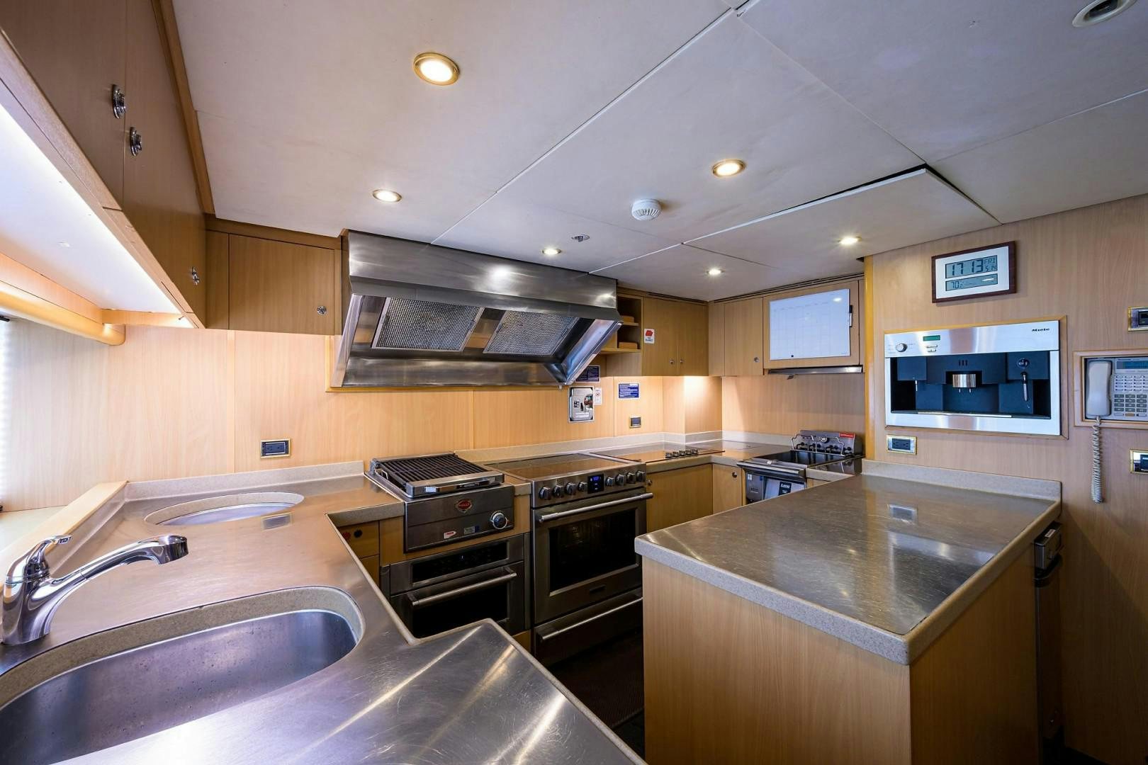 a kitchen with a stove and a sink aboard CABERNET Yacht for Sale