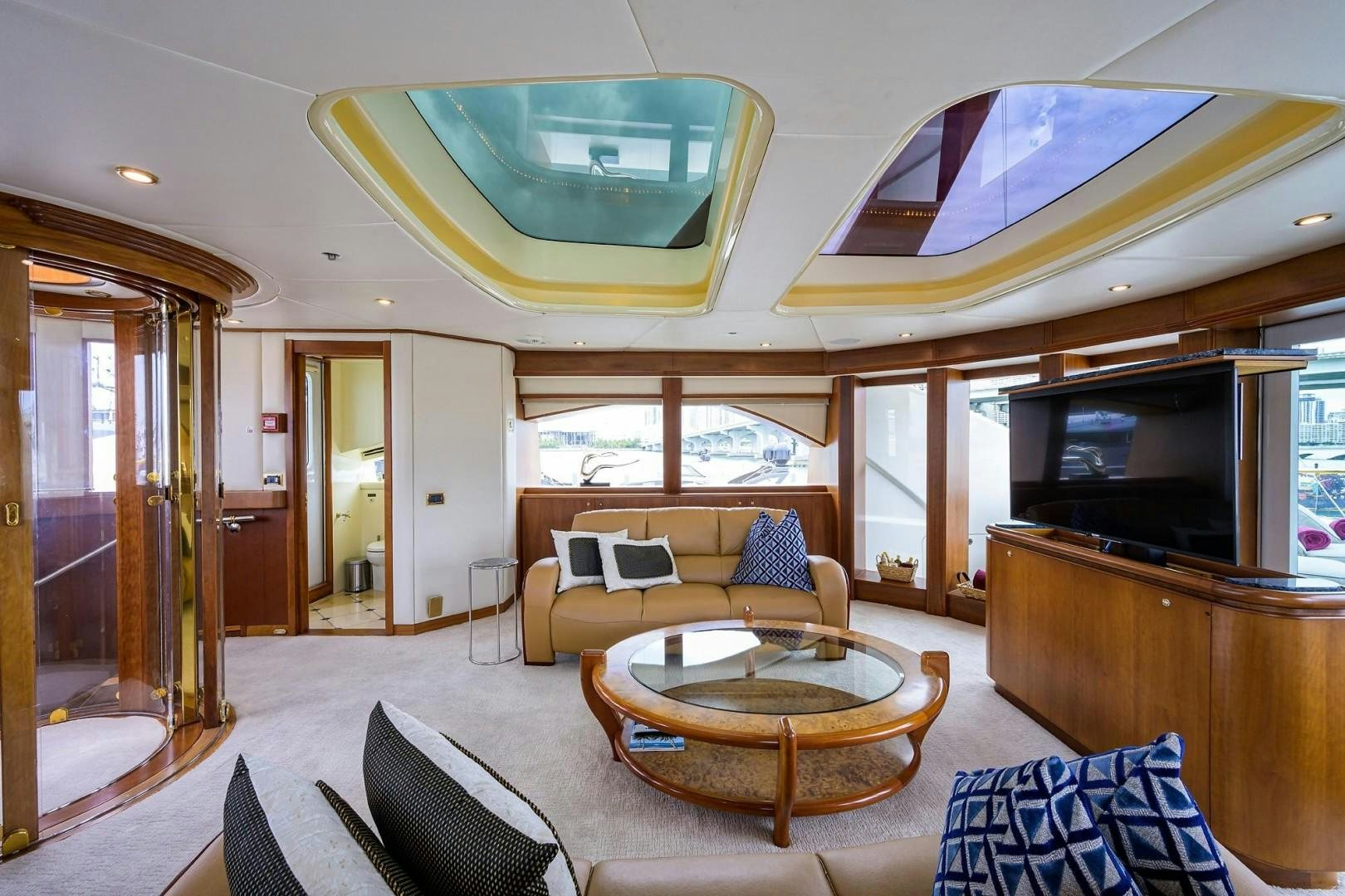 a living room with a couch and a table aboard CABERNET Yacht for Sale