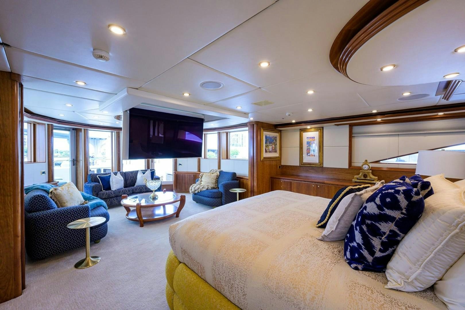 a large bedroom with a bed and a couch aboard CABERNET Yacht for Sale