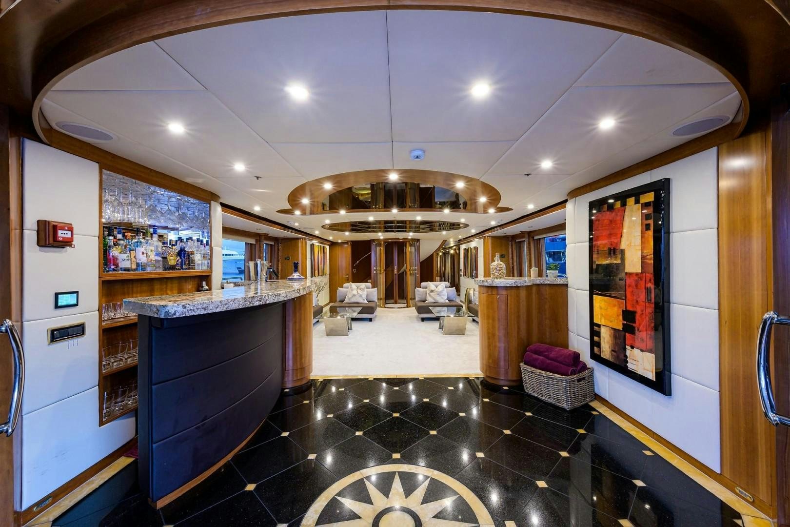 a large room with a large black counter and a large mirror aboard CABERNET Yacht for Sale
