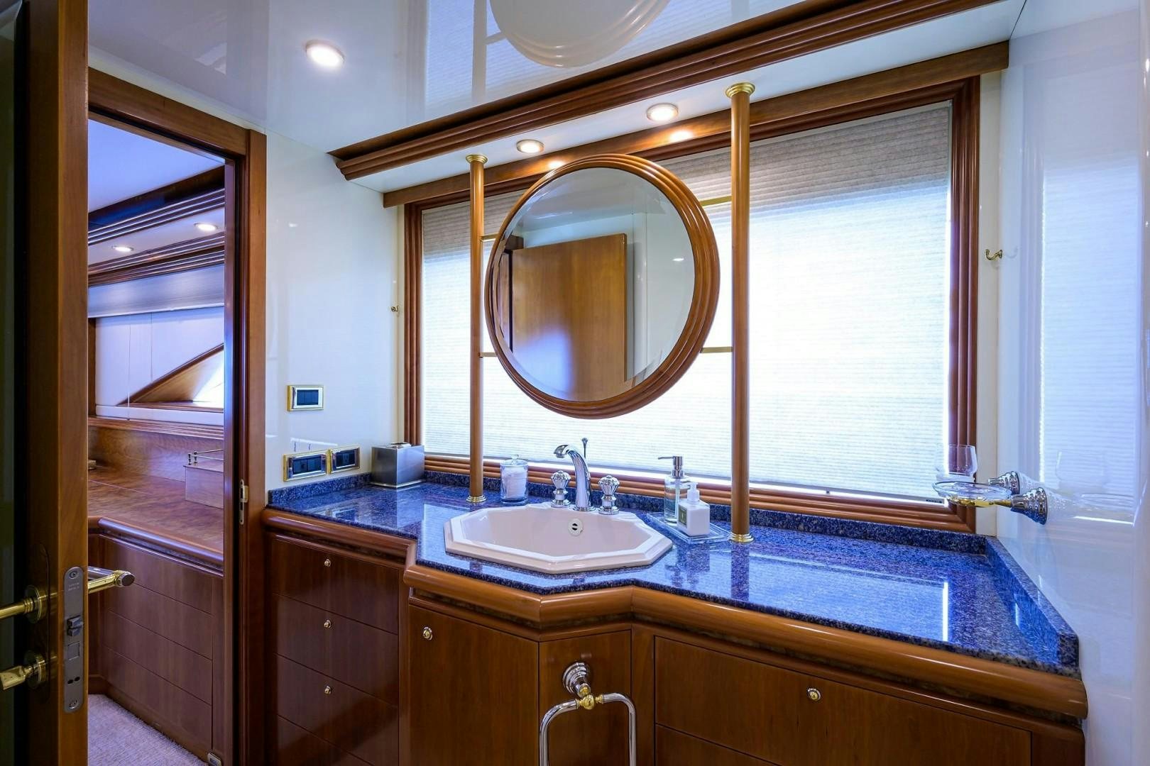 a bathroom with a large mirror aboard CABERNET Yacht for Sale