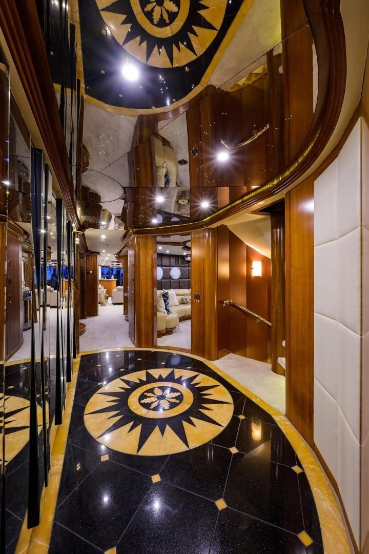 a large room with a chandelier and a chandelier aboard CABERNET Yacht for Sale