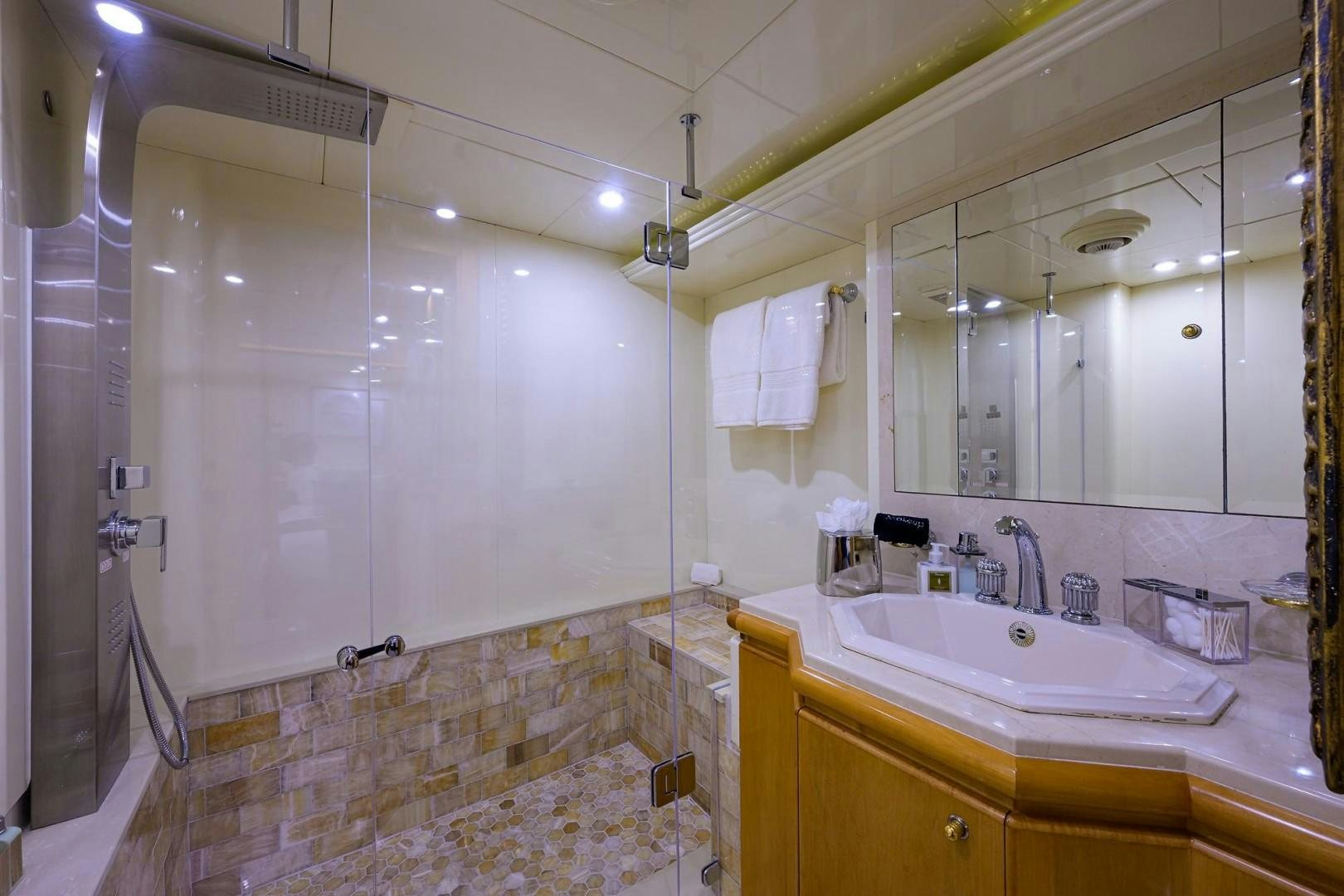a bathroom with a large mirror aboard CABERNET Yacht for Sale