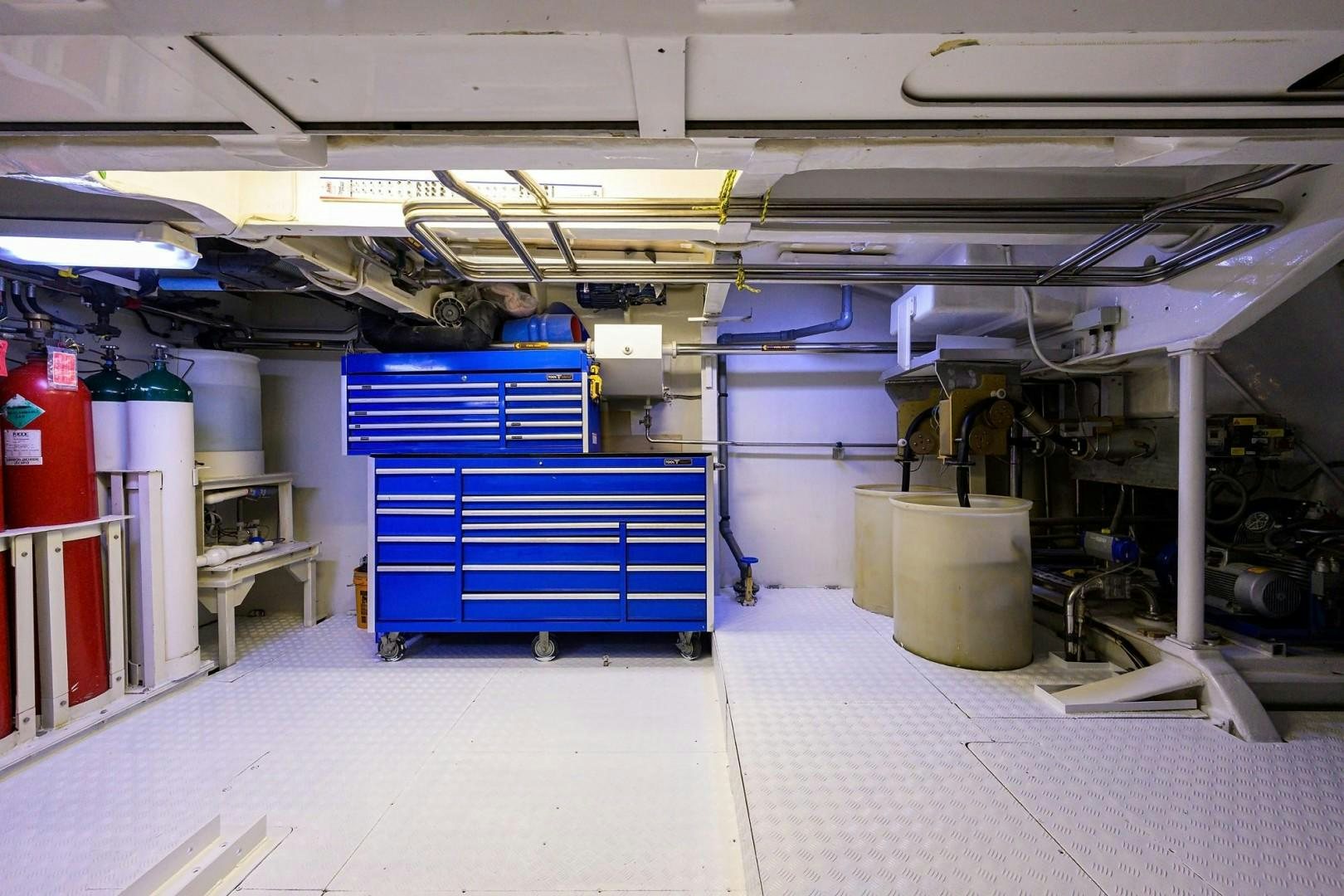 a warehouse with blue containers aboard CABERNET Yacht for Sale