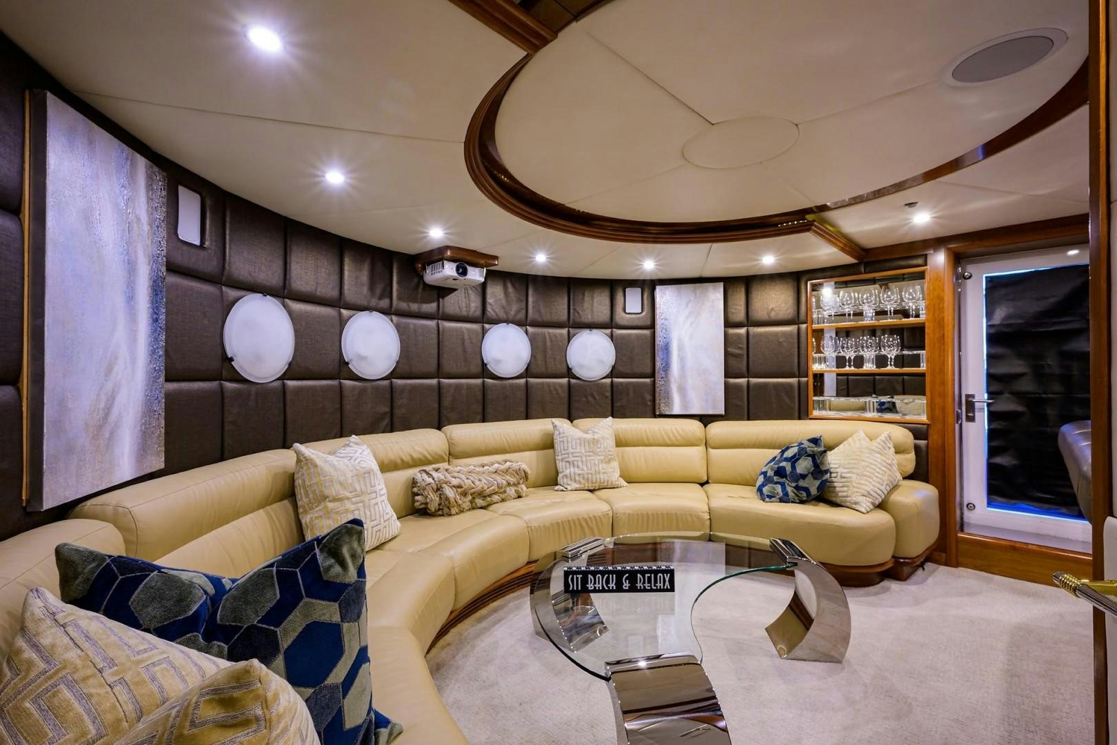 a living room with a couch and a coffee table aboard CABERNET Yacht for Sale