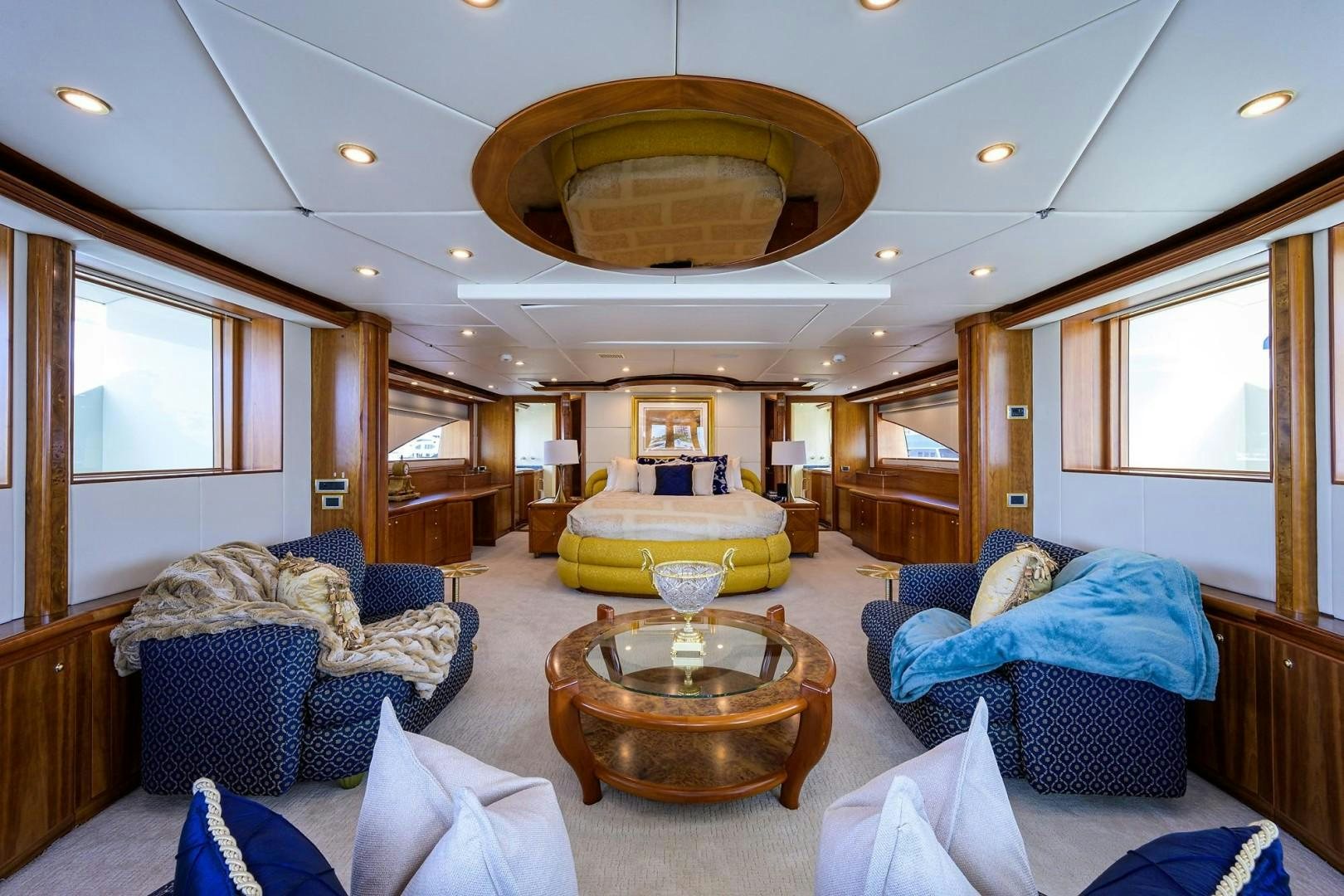 a living room with a large chandelier aboard CABERNET Yacht for Sale
