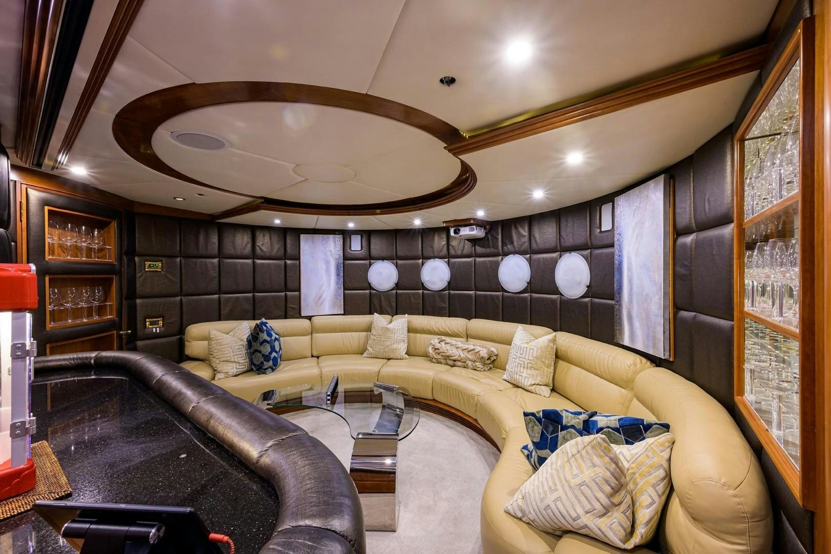 a living room with a large sofa aboard CABERNET Yacht for Sale