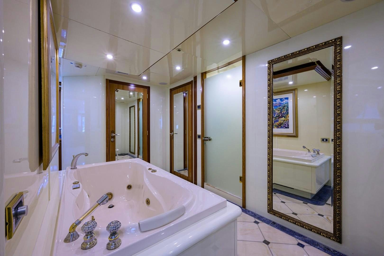 a bathroom with a large bathtub aboard CABERNET Yacht for Sale