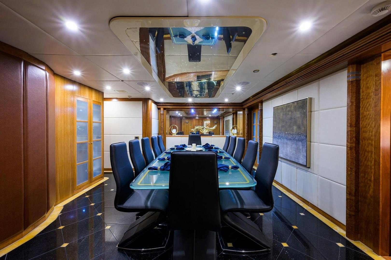 a conference room with a table and chairs aboard CABERNET Yacht for Sale