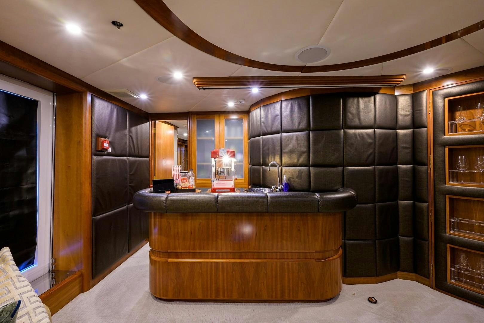 a room with a large wood cabinet aboard CABERNET Yacht for Sale