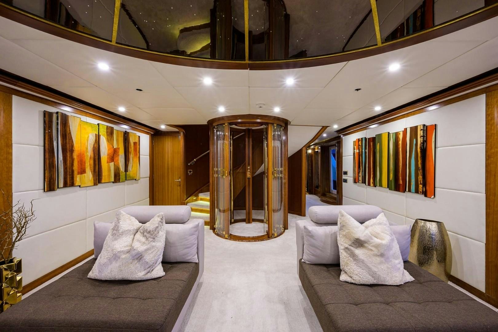 a large room with a bed and a large mirror aboard CABERNET Yacht for Sale