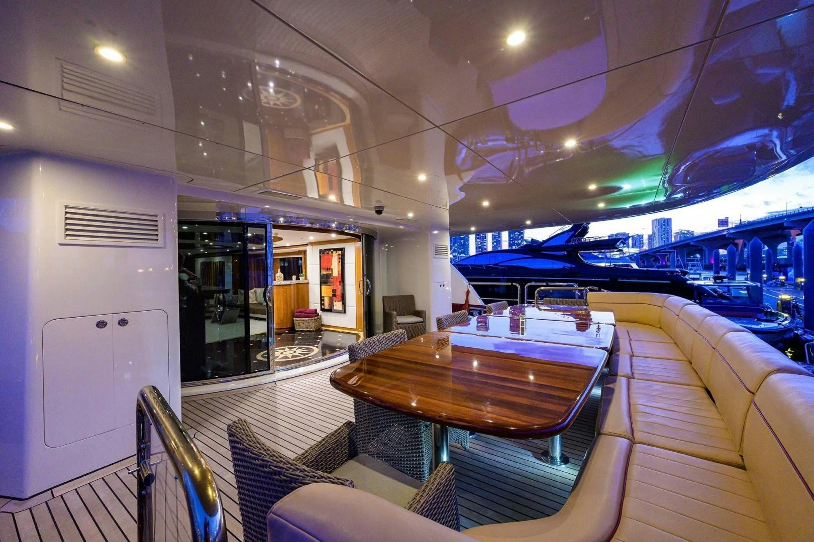 a table and chairs in a train aboard CABERNET Yacht for Sale