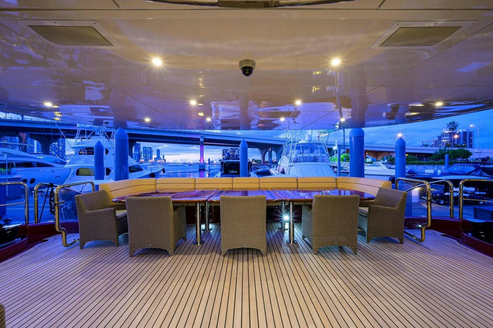 a large swimming pool with chairs aboard CABERNET Yacht for Sale