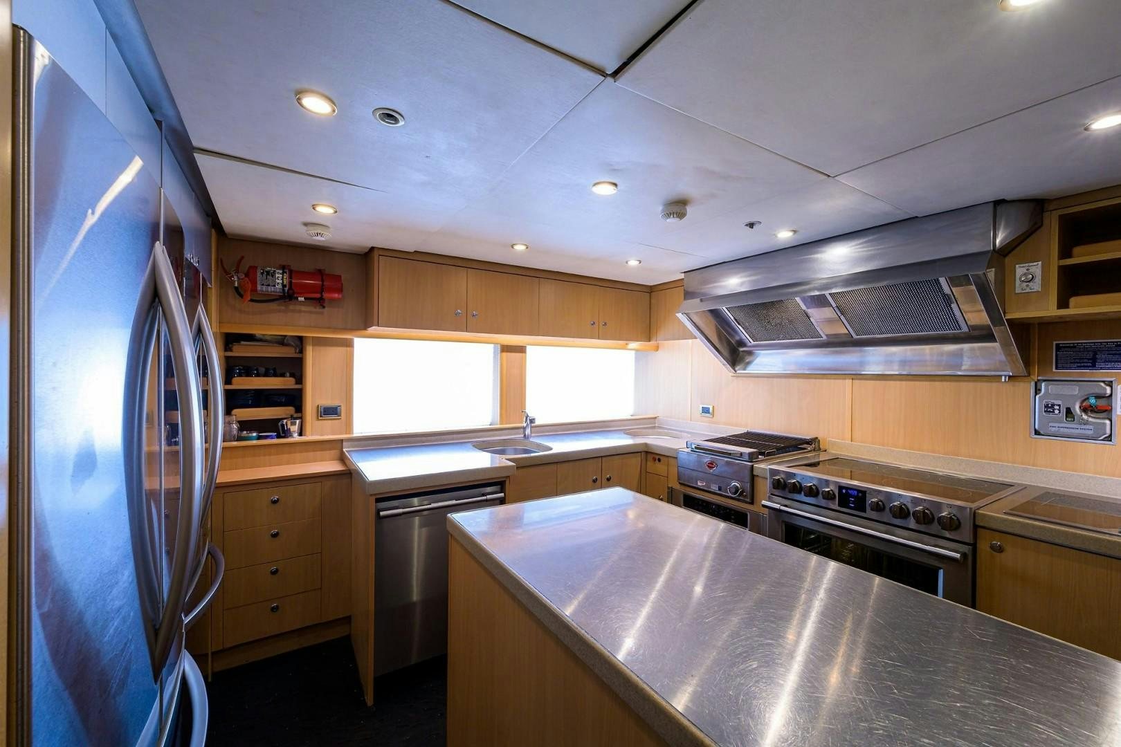 a kitchen with a stainless steel stove aboard CABERNET Yacht for Sale