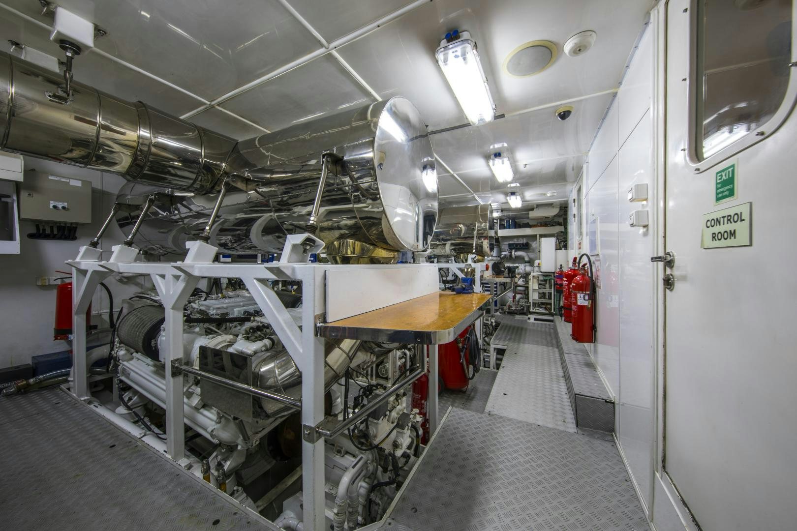 a room with white machines aboard DYNASTY Yacht for Sale