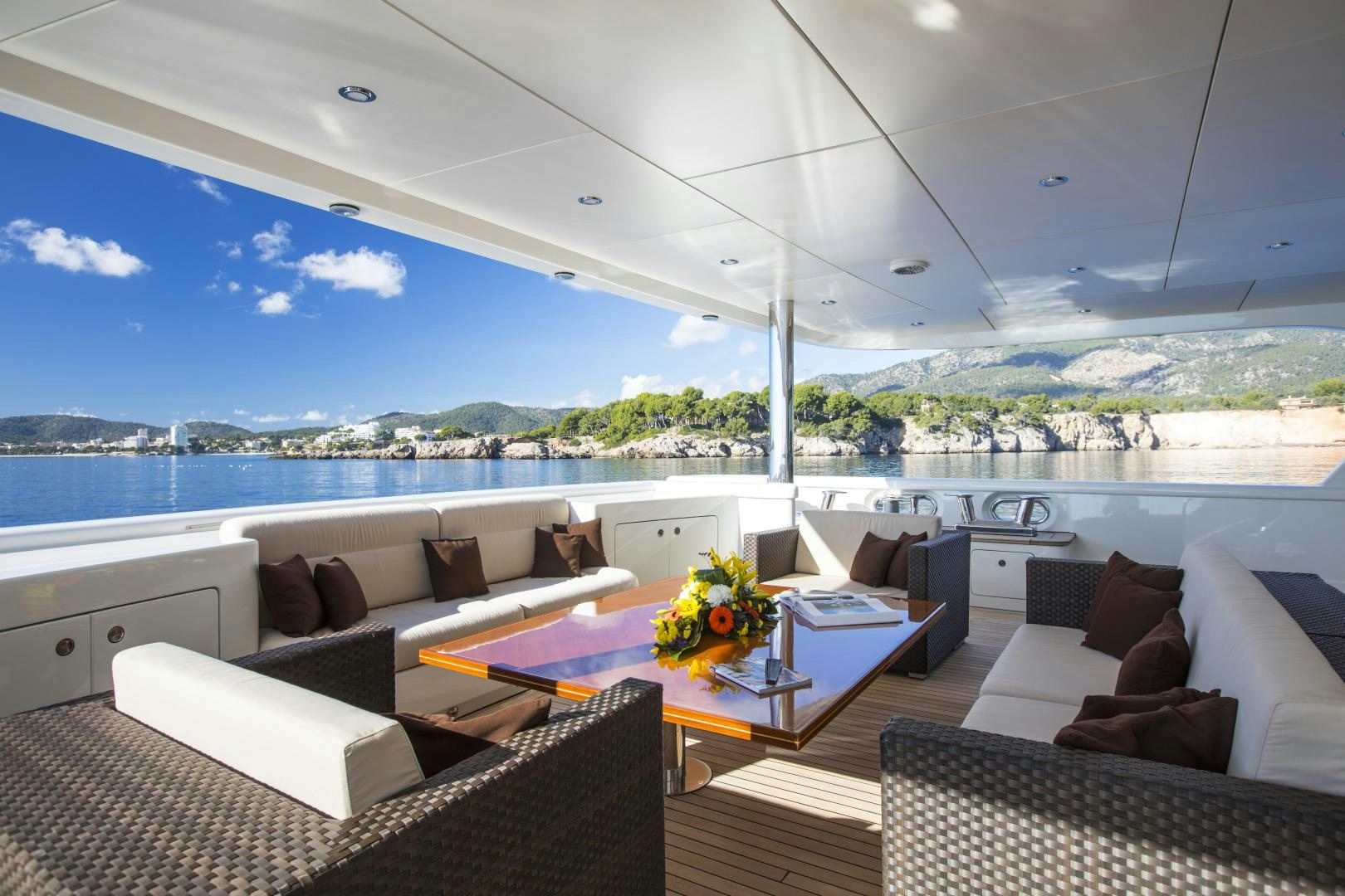 a living room with a large patio aboard DYNASTY Yacht for Sale