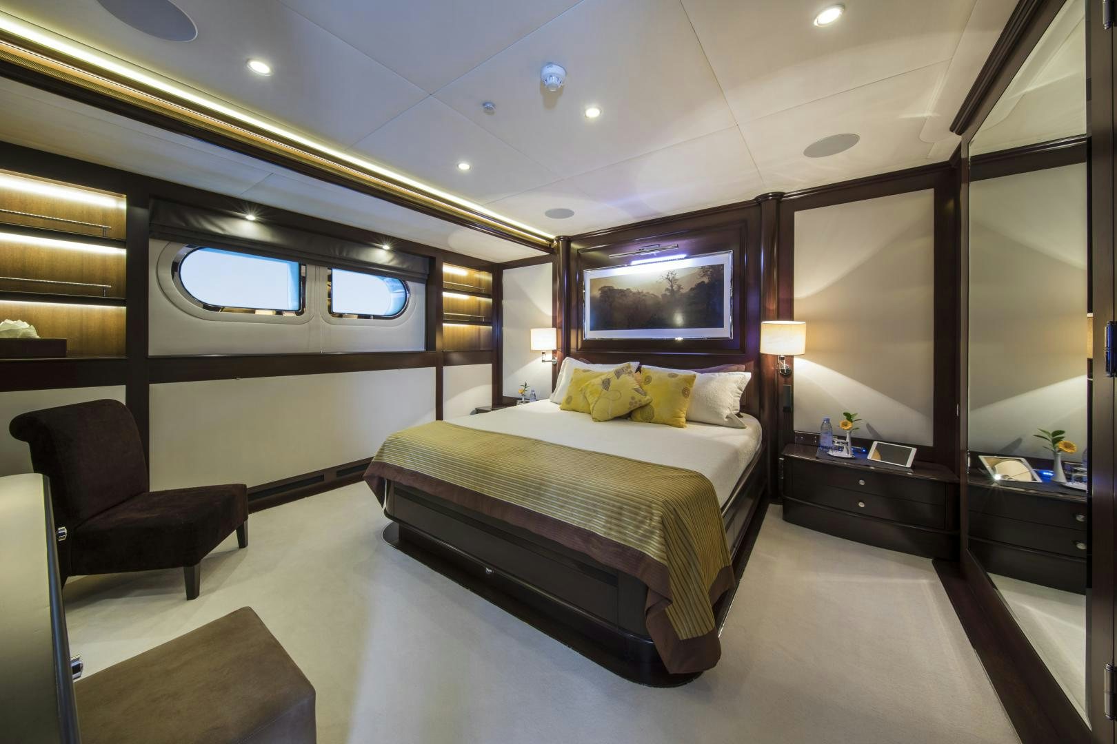 a hotel room with a bed and a tv aboard DYNASTY Yacht for Sale