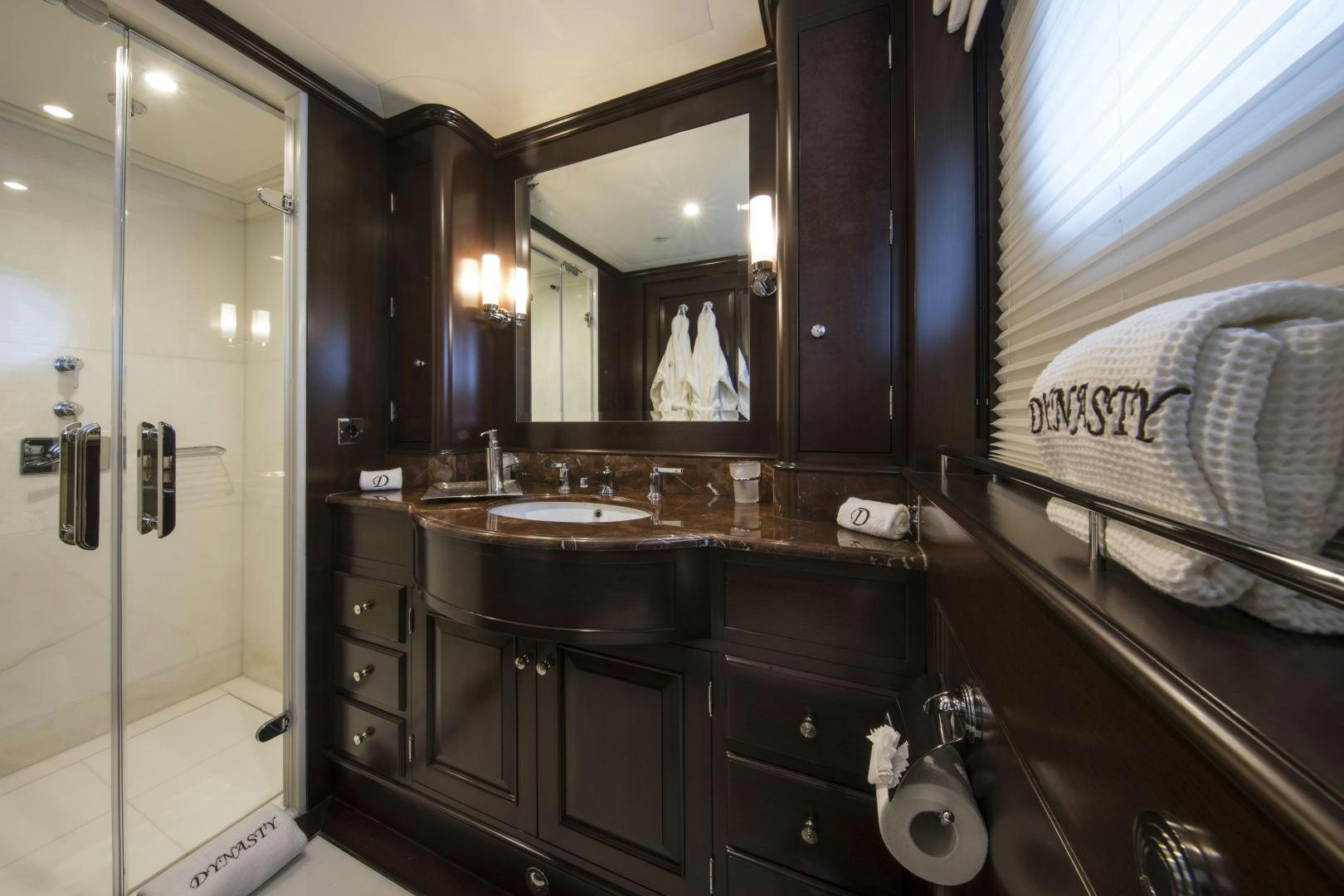 a bathroom with a large mirror aboard DYNASTY Yacht for Sale