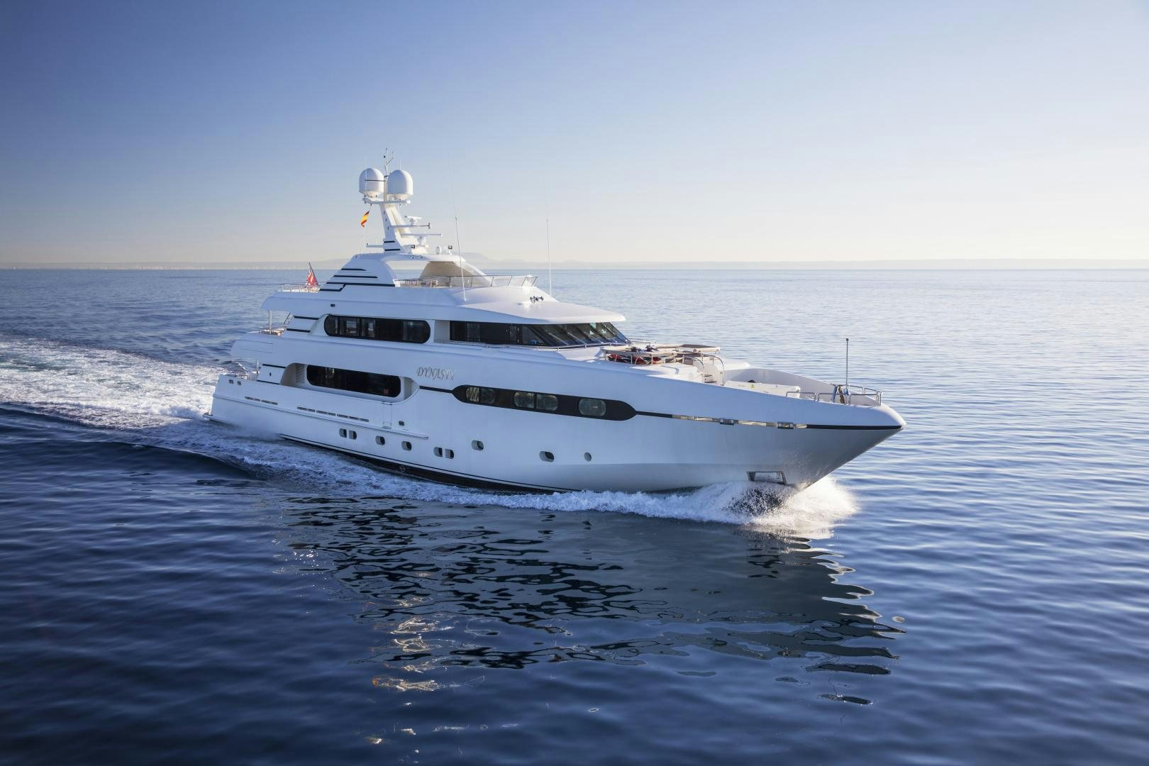 a white yacht on the water aboard DYNASTY Yacht for Sale
