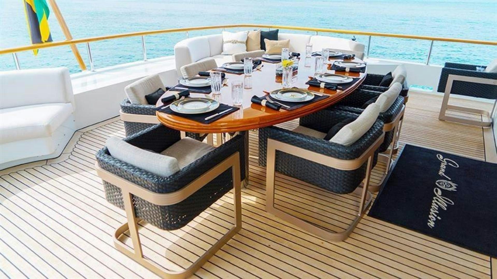 a table with chairs around it aboard GRAND ILLUSION Yacht for Sale