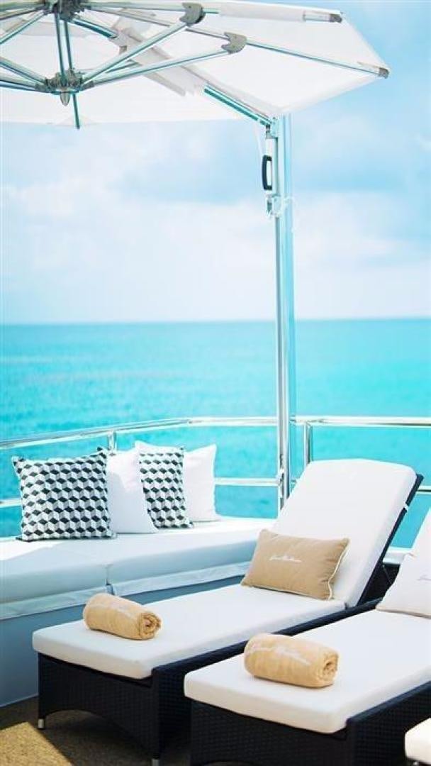 a bed with pillows on it aboard GRAND ILLUSION Yacht for Sale