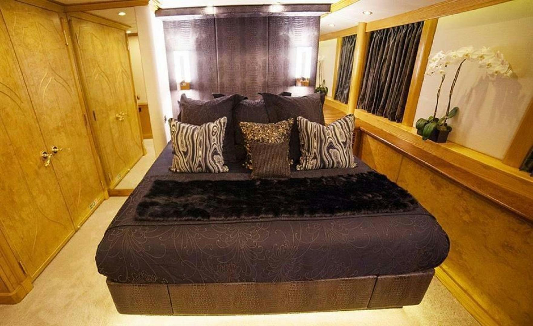 a bed in a room aboard GRAND ILLUSION Yacht for Sale