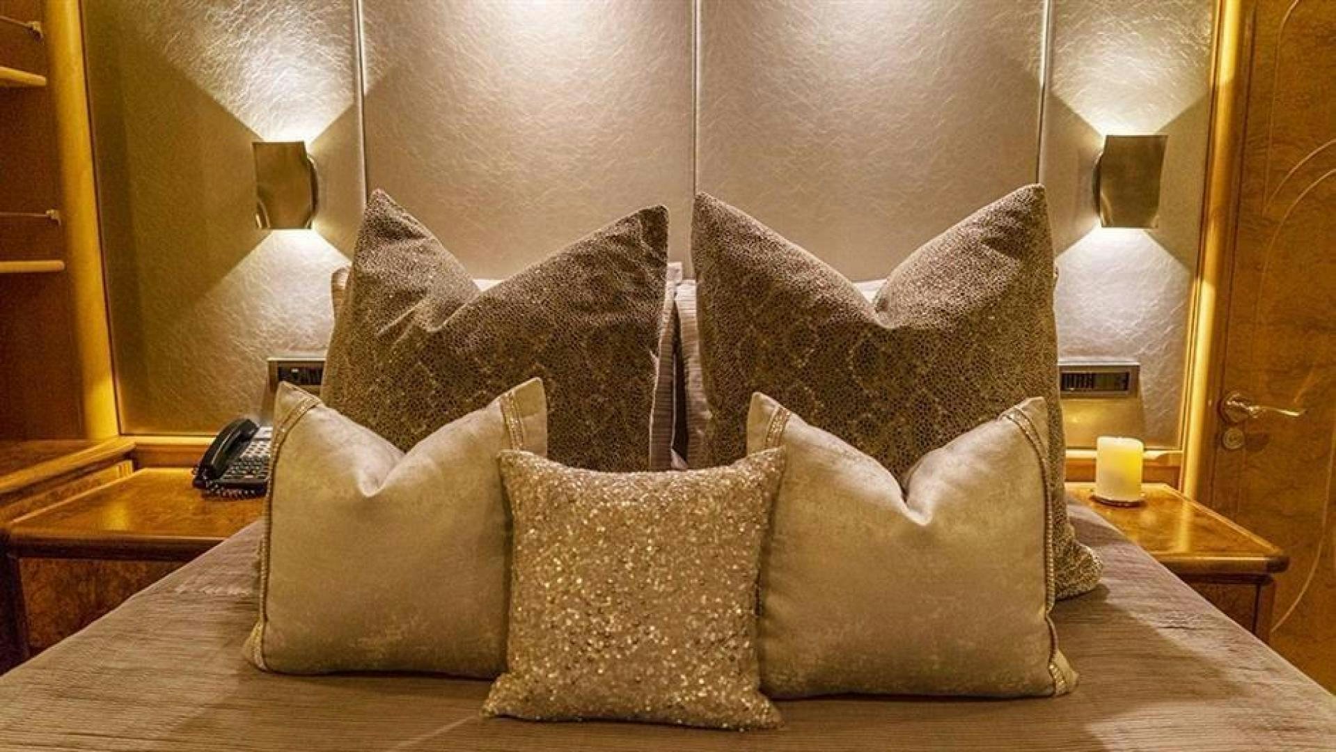 a bed with pillows aboard GRAND ILLUSION Yacht for Sale