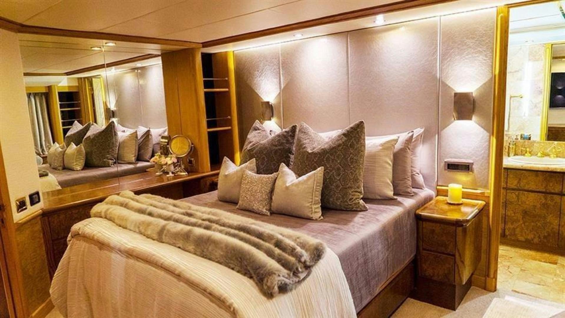 a bed with pillows and pillows aboard GRAND ILLUSION Yacht for Sale