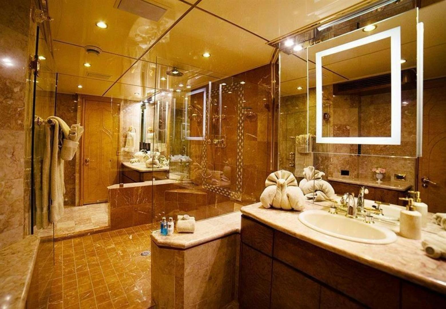a bathroom with a large mirror aboard GRAND ILLUSION Yacht for Sale