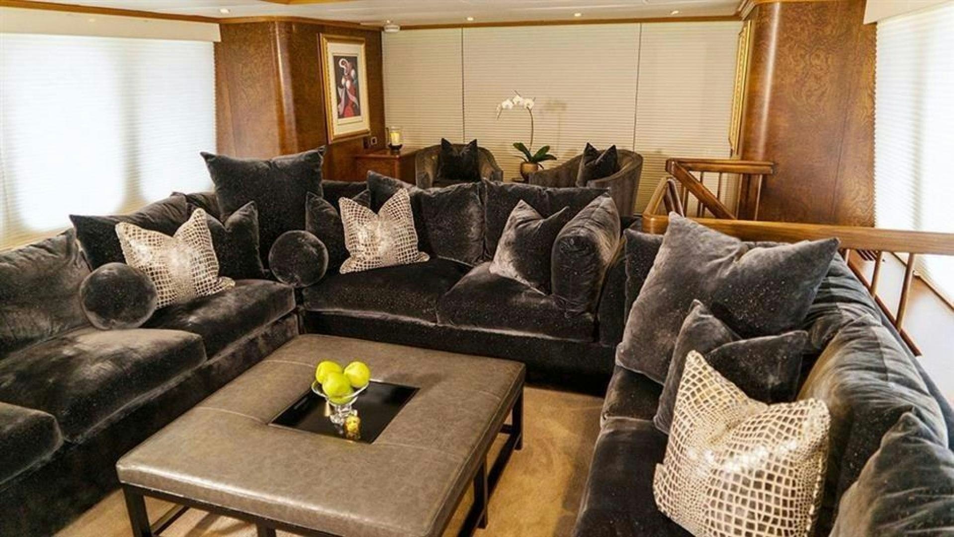 a living room with leather couches aboard GRAND ILLUSION Yacht for Sale