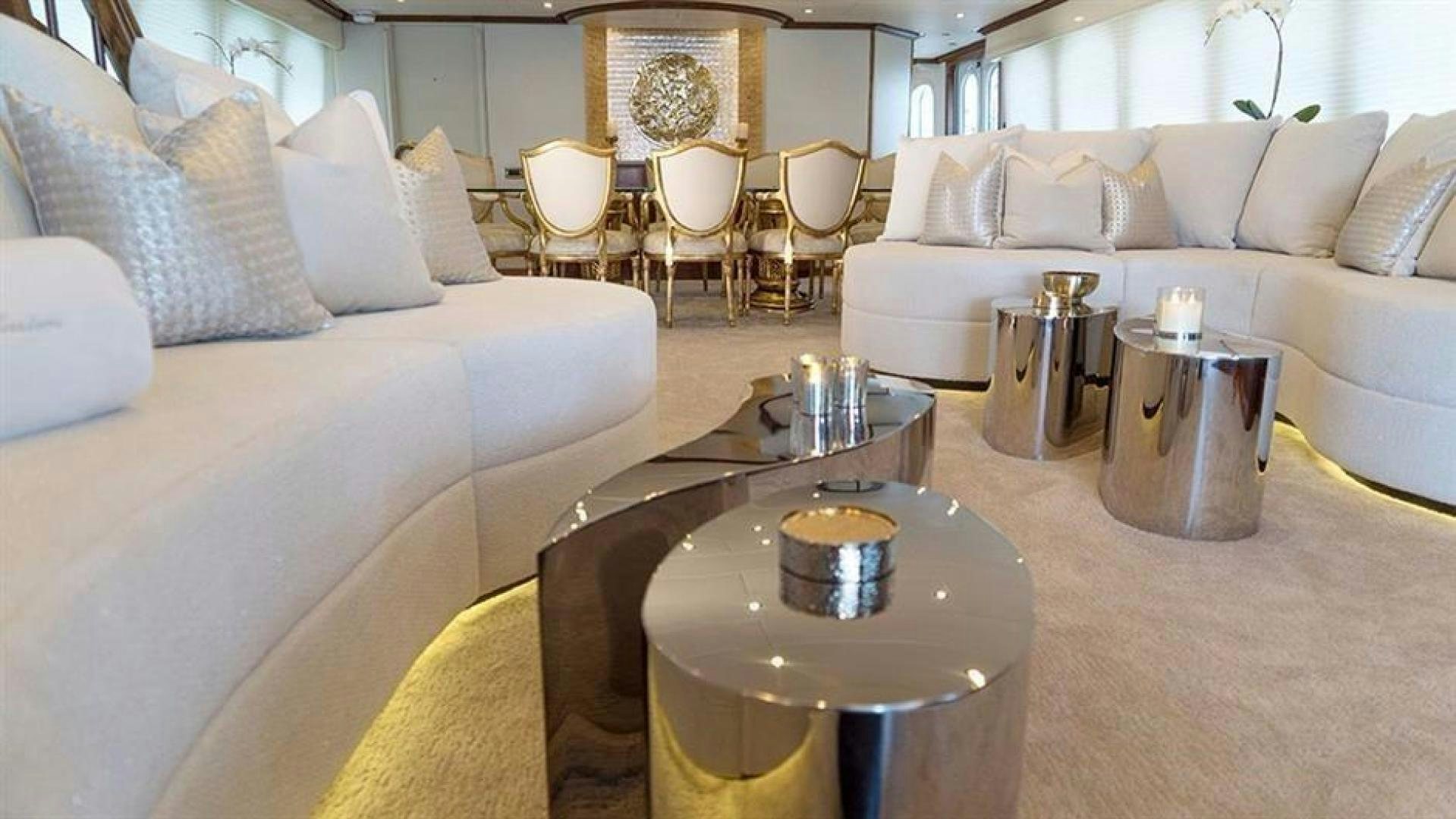 a living room with a coffee table aboard GRAND ILLUSION Yacht for Sale
