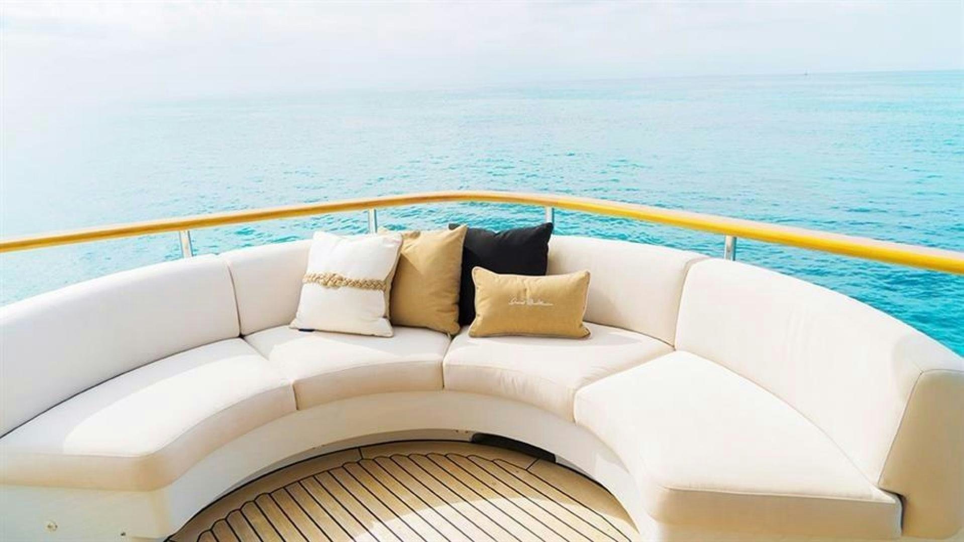 a couch with pillows on it aboard GRAND ILLUSION Yacht for Sale