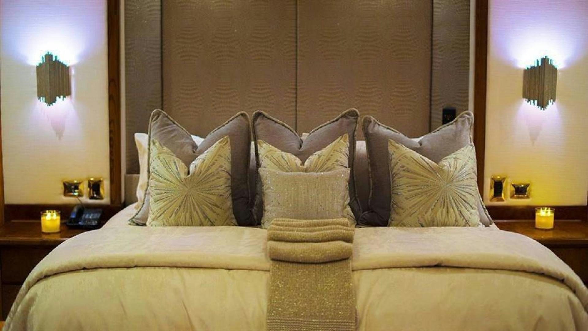 a bed with pillows aboard GRAND ILLUSION Yacht for Sale
