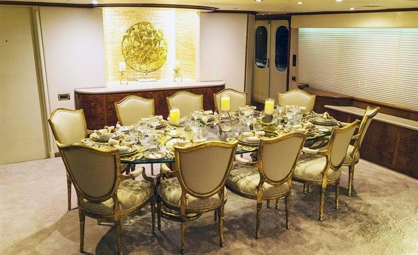 a table with chairs around it aboard GRAND ILLUSION Yacht for Sale