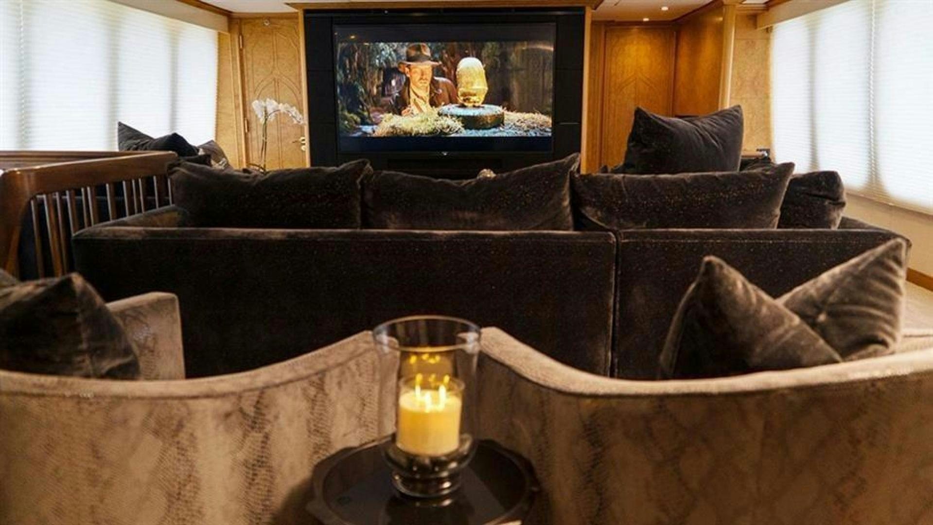 a glass of beer on a couch aboard GRAND ILLUSION Yacht for Sale