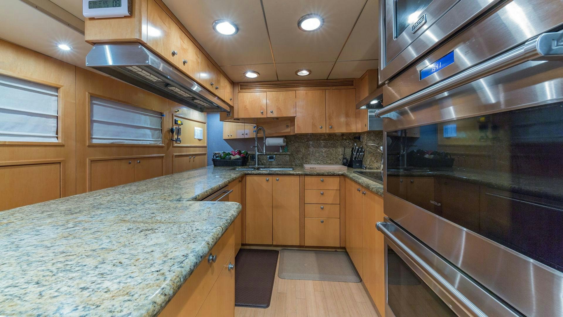 a kitchen with a large island aboard AT LAST Yacht for Sale