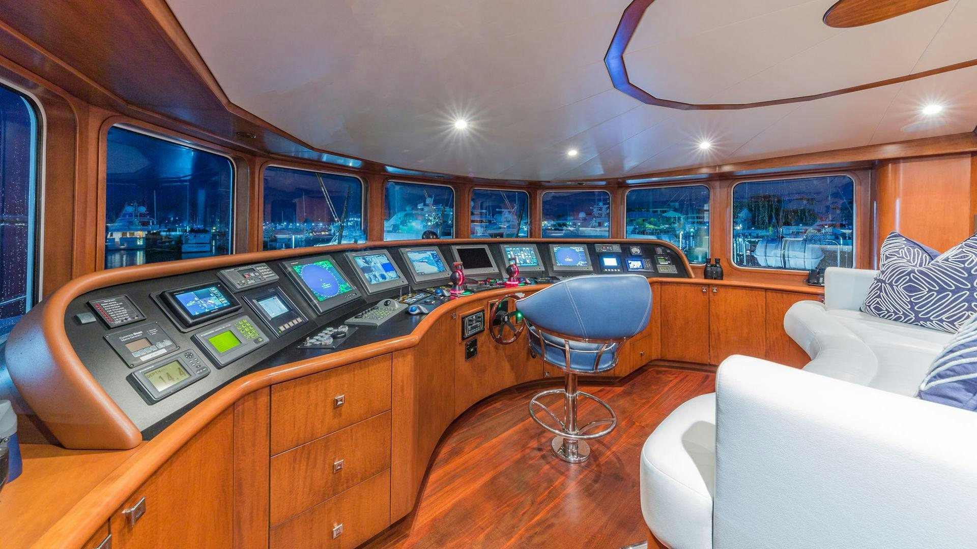 a room with a desk and chairs aboard AT LAST Yacht for Sale