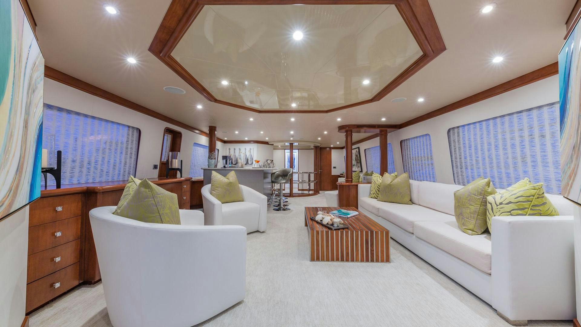 a living room with a large window aboard AT LAST Yacht for Sale