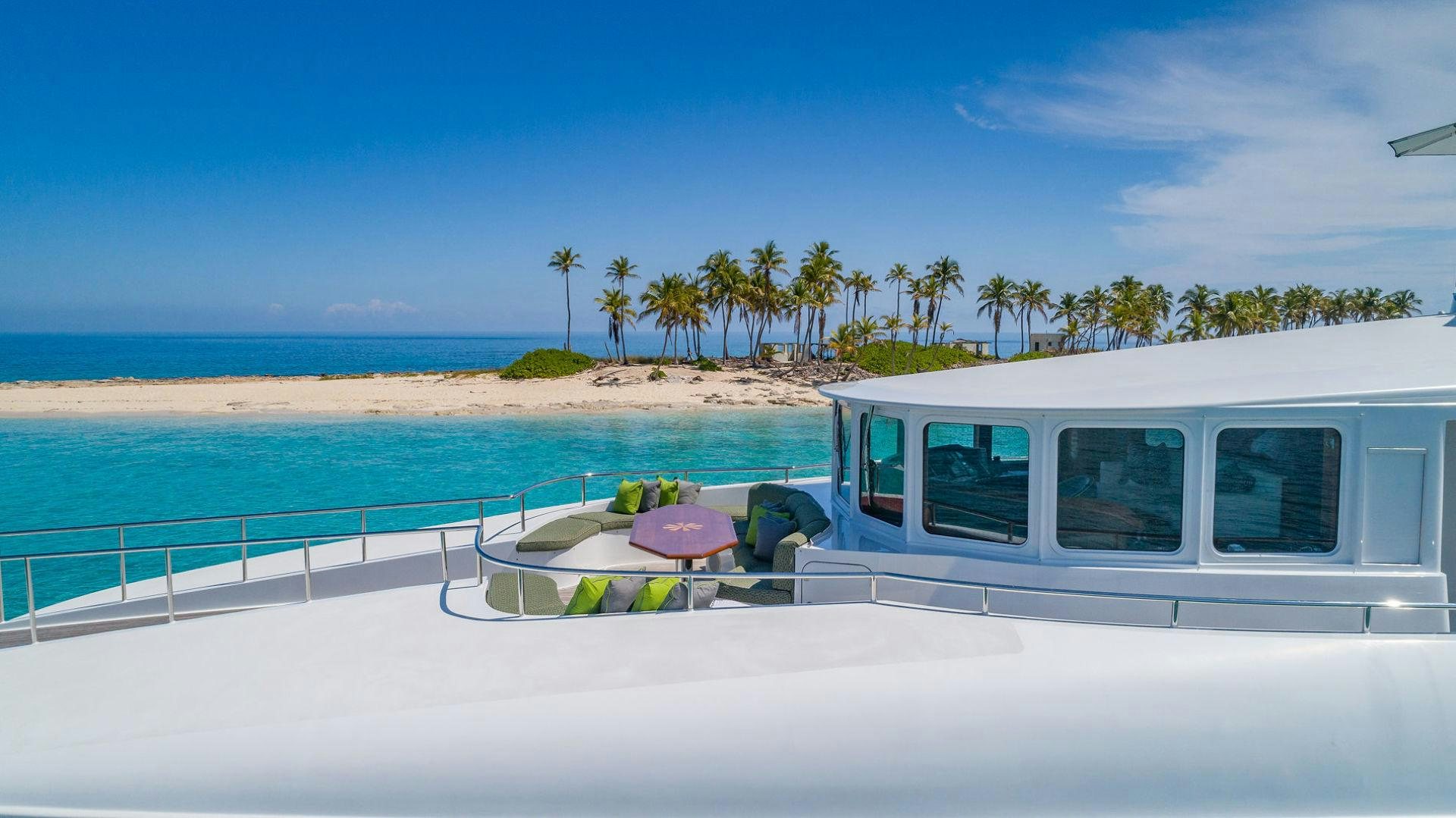 a white van on a beach aboard AT LAST Yacht for Sale