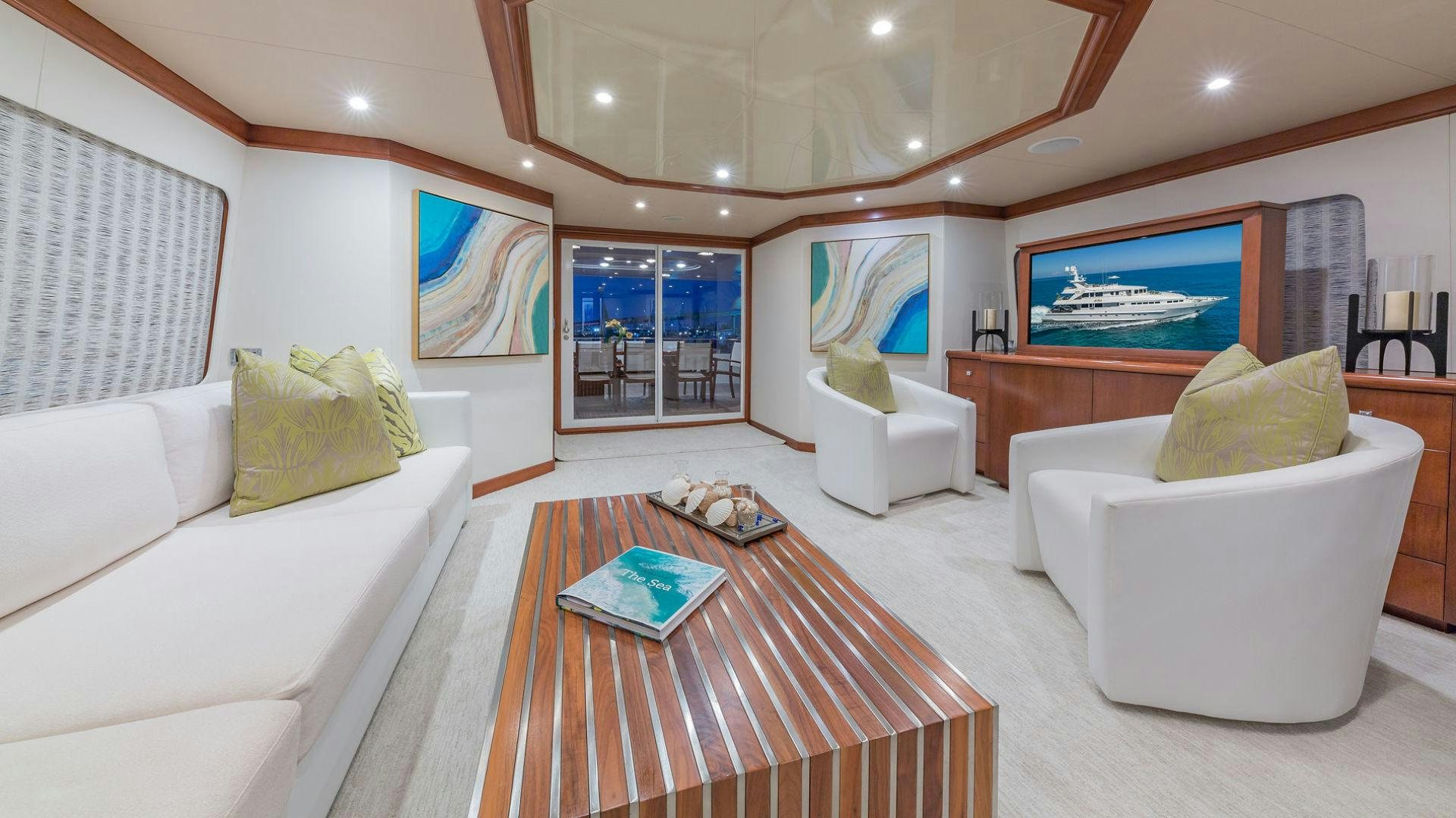 a living room with a large window aboard AT LAST Yacht for Sale