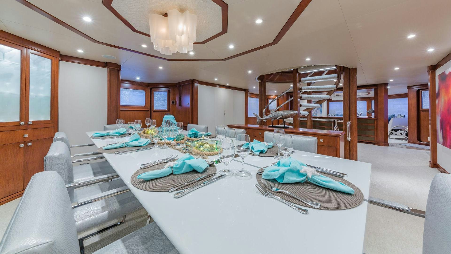 a large kitchen with a dining table aboard AT LAST Yacht for Sale