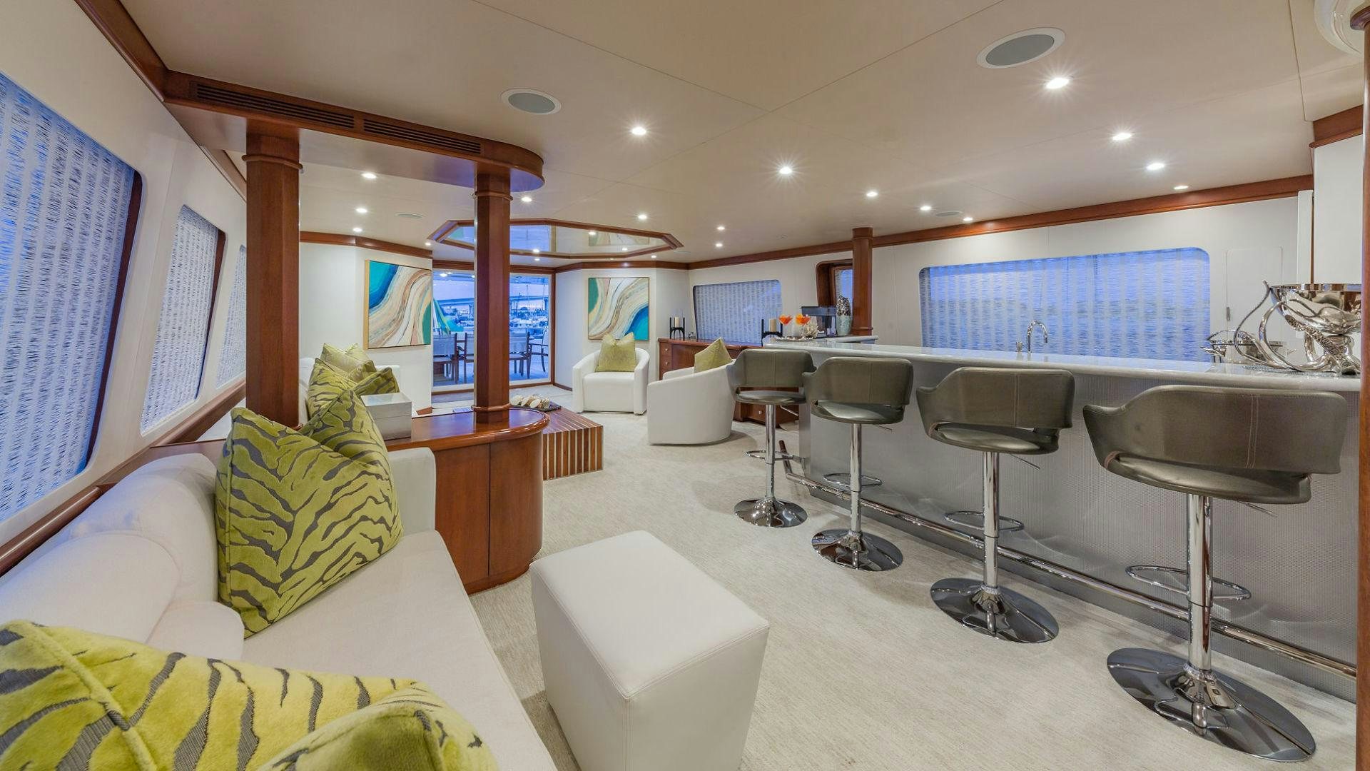 a room with a couch and a table and chairs aboard AT LAST Yacht for Sale