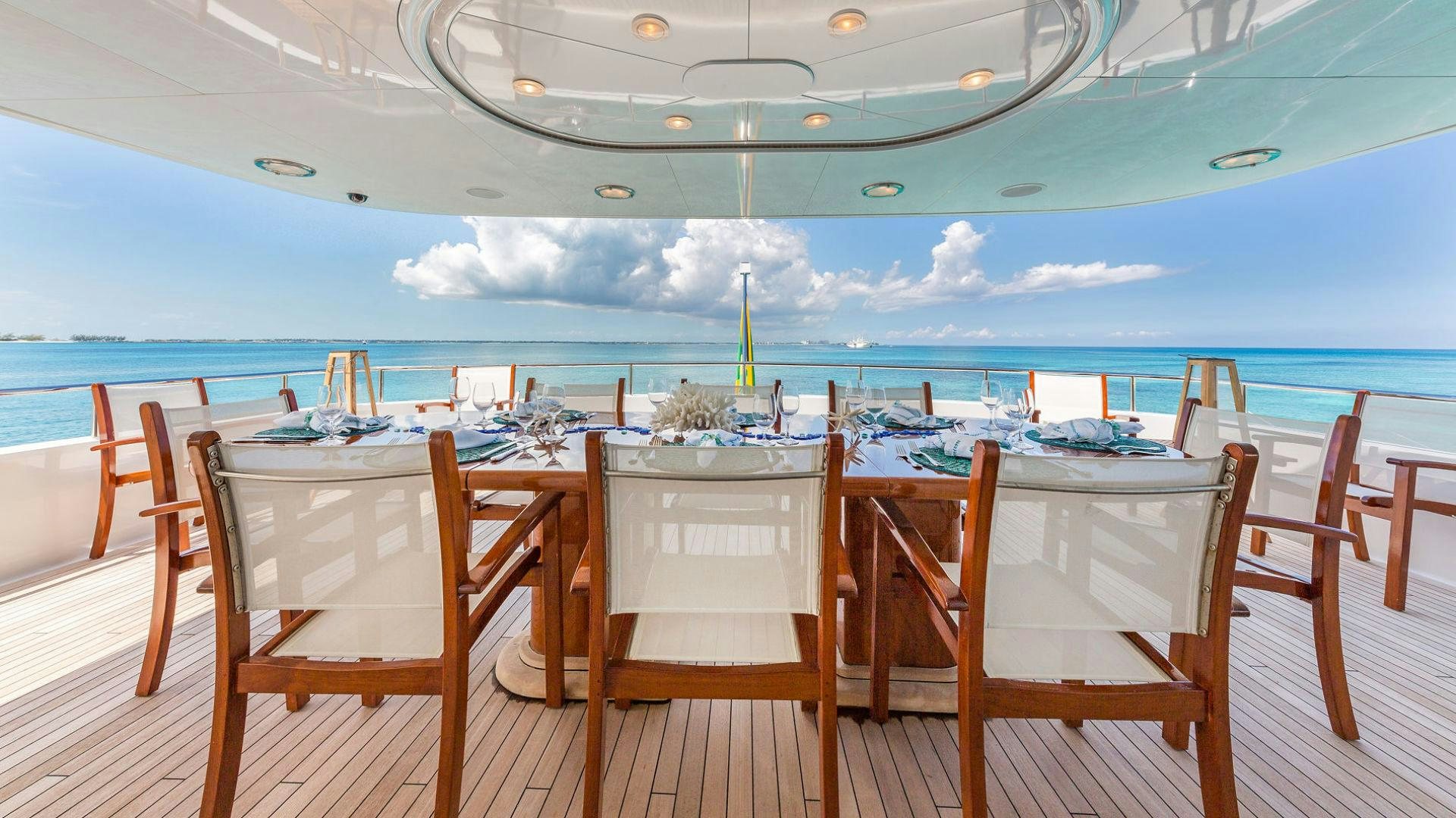 a table set for a dinner party aboard AT LAST Yacht for Sale