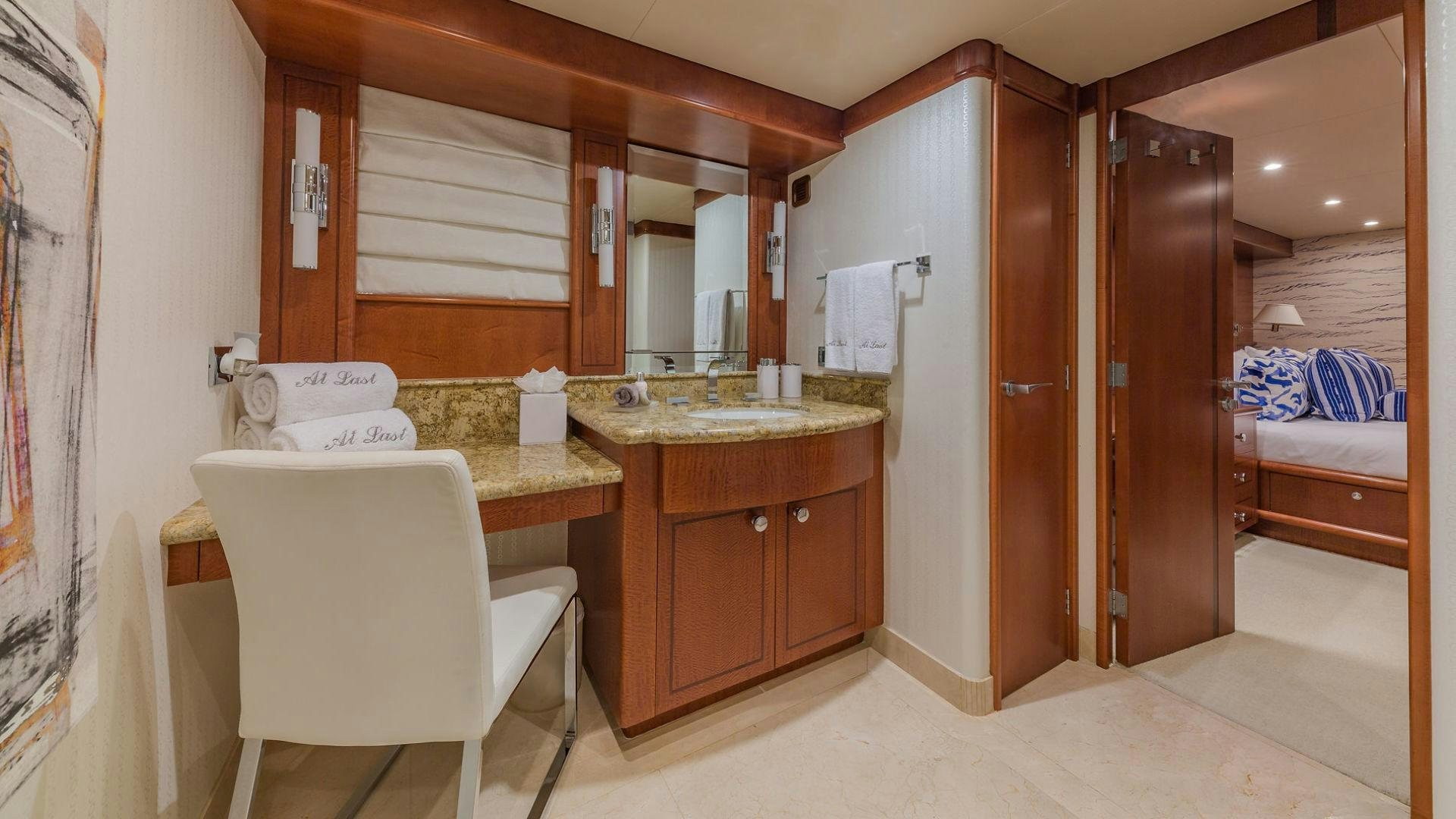 a bathroom with a sink and a mirror aboard AT LAST Yacht for Sale
