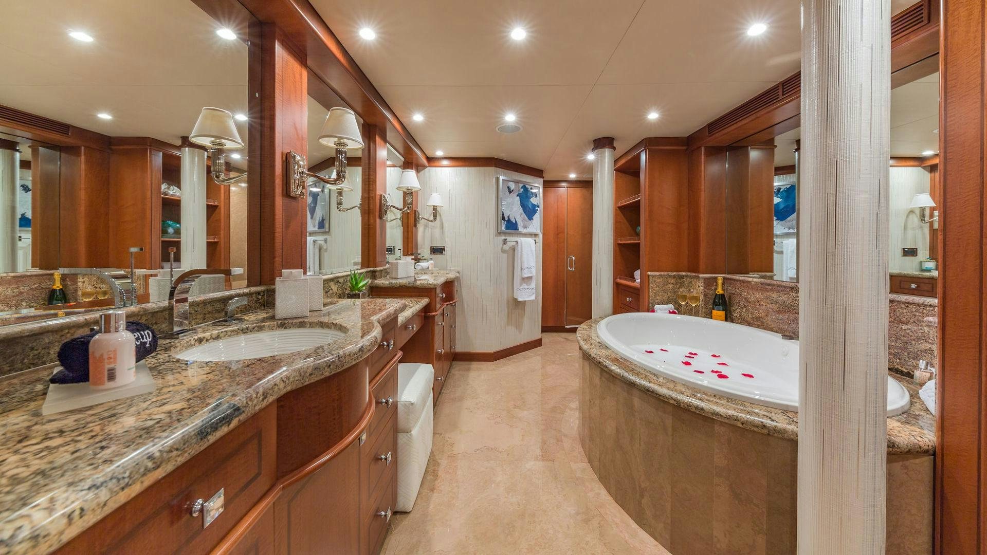 a bathroom with a large bathtub aboard AT LAST Yacht for Sale