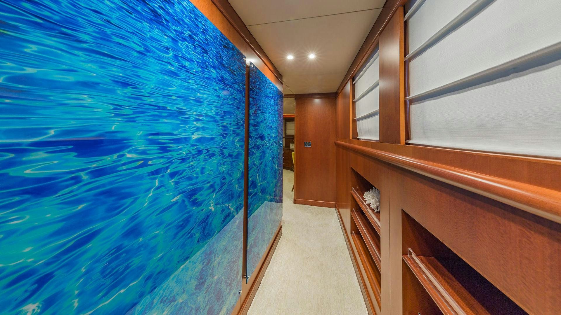 a room with a blue pool aboard AT LAST Yacht for Sale