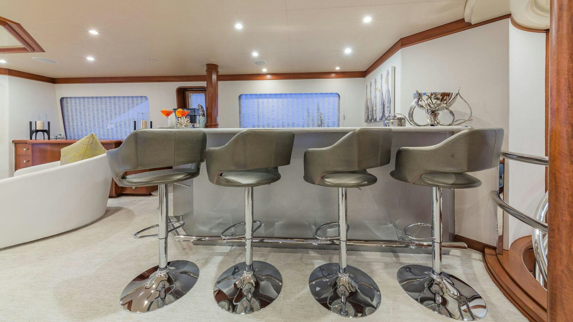 a room with a table and chairs aboard AT LAST Yacht for Sale